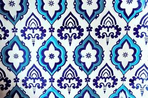 plate with orient blue and white pattern on wooden background photo