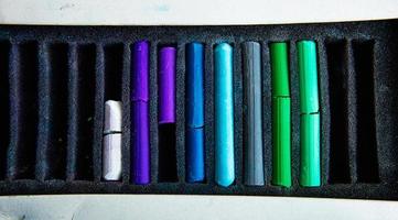 Pieces of colorful pastel chalks in the box photo