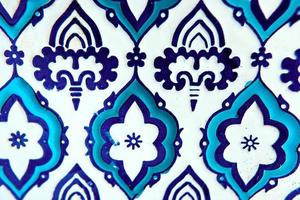 plate with orient blue and white pattern on wooden background photo