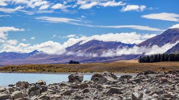 The rocky shore of Lake Tekapo photo