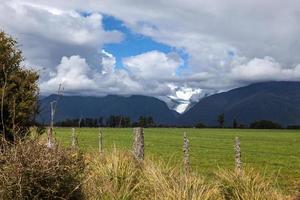 Distant view of the Fox Glacier in New Zealand photo