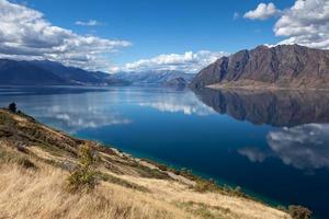 Scenic view of Lake Hawea and distant mountains photo