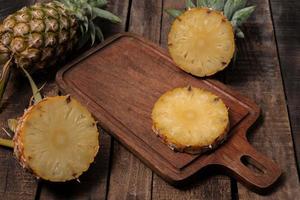 Healthy food pineapple sliced on wood table. photo