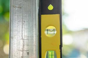 Spirit level or construction water level on steel pipe photo