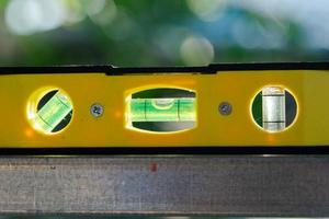 Spirit level or construction water level on steel pipe photo