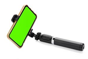 Selfie stick with smart phone isolated on white background. clipping path photo