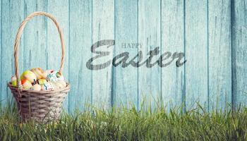 Easter background with colorful easter eggs on wooden background. photo