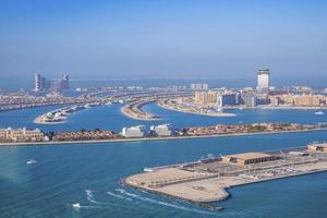 Beautiful port with city at jumeirah island against clear blue sky photo