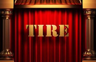tire golden word on red curtain photo