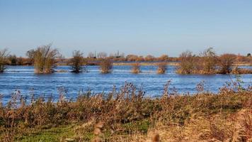 River nearly overflowing after heavy rain near Ely photo