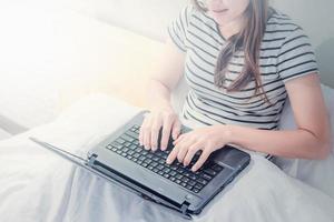 Young asian woman work form home. After the Coronavirus or Covid-19. photo