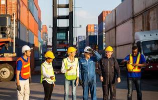 Success Teamwork Concepts, Cheerful engineer and worker team at cargo containers photo
