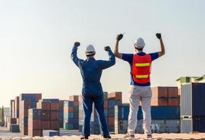 Business Engineer Man and worker foreman celebration success happiness on a containers cargo, Success and Teamwork concept photo