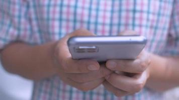 Closeup businesswoman texting message on mobile phone outside of office. video