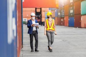 Engineer and worker team checking containers box from cargo, Logistic and teamwork concept photo