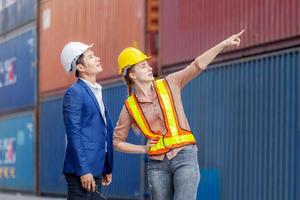 Engineer and worker team checking containers box from cargo, Logistic and teamwork concept photo