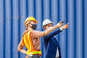 Engineer and worker team checking containers box from cargo, Logistic and teamwork concept photo