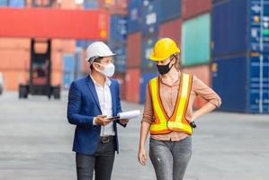 Engineer and worker team checking containers box from cargo, Logistic and teamwork concept photo