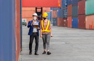 Engineer and worker team checking containers box from cargo, Logistic and teamwork concept photo