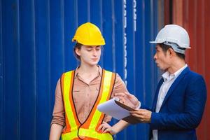Engineer and worker team checking containers box from cargo, Logistic and teamwork concept photo
