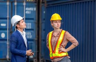 Engineer and worker team checking containers box from cargo, Logistic and teamwork concept photo