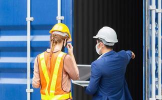 Engineer and worker team checking containers box from cargo, Logistic and teamwork concept photo