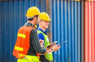 Engineer and worker team checking containers box from cargo, Happiness and Teamwork concept photo