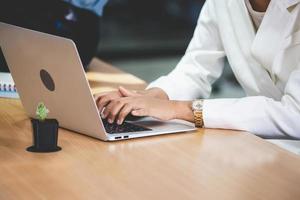 Young businesswoman using laptop computer photo