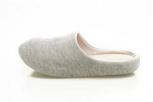 grey slipper on white background photo