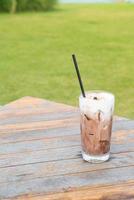 ice chocolate milkshake on table photo