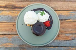 chocolate lava with vanilla ice-cream and whipping cream photo