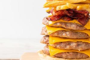 pork burger with cheese, bacon and french fries photo