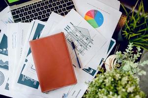 The desk and graph are placed on the business desk. Business concept With copy space photo