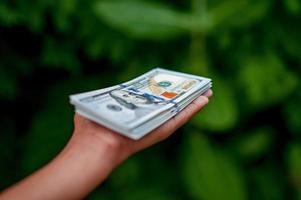 Hand and dollar pictures Concept of business finance photo