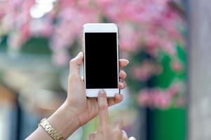 Hands and phones used for online communication Concepts of telephone and technology With copy space photo