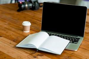 A desk with a business computer and a note on the desk. Business concept with copy space. photo