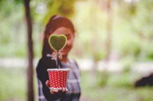 Beautiful green hand and heart images Valentines Day concept With copy space photo