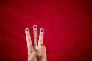 Red background and fingers and cute smile Art concept photo