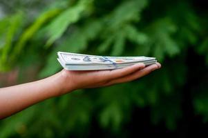 Hand and dollar pictures Concept of business finance photo