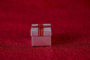 Red background image and gift box Valentine's Day concept photo