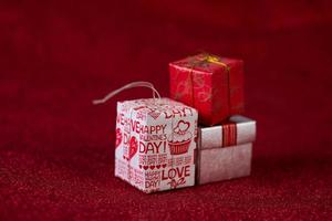 Red background image and gift box Valentine's Day concept photo