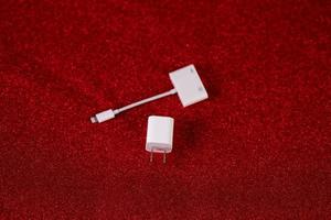 Red background image and USB computer plug device Technology concept photo
