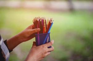 Hand and pencil pictures, green background color Education concept With copy space photo