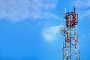 Telecommunication tower and satellite on blue sky photo