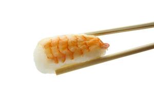 sushi in chopsticks isolated on white background photo