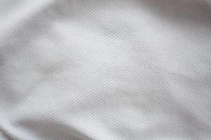 Close up shot of white textured football jersey photo