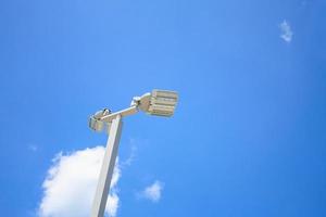 LED street lamps with energy-saving technology, cloud on sky background photo