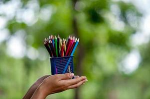 Hand and pencil pictures, green background color Education concept With copy space photo