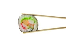 Sushi maki in chopsticks isolated on white background photo