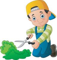 Young gardener trims a grass with scissors